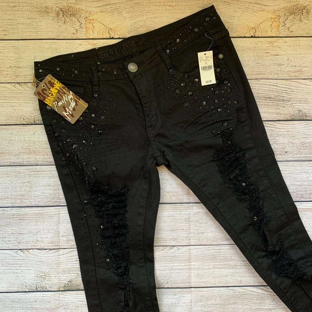 Studded black denim ripped jeans